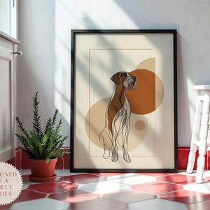Puede incluir: Impresión artística enmarcada con un dibujo lineal de un perro en marrón y blanco. La obra de arte está sobre un fondo beige con formas geométricas naranjas. La impresión se exhibe sobre un suelo de baldosas rojas y blancas.