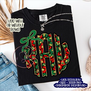May include: Black sweatshirt with a festive monogram design. The monogram features red and green leopard print letters with gold glitter accents, and a green bow. The text "USE WITH OR WITHOUT BOWS" is also visible.