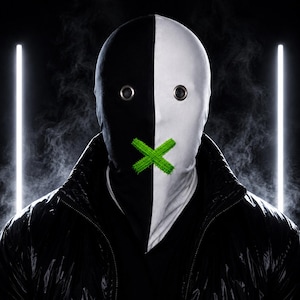 May include: A full-face mask featuring a split black and white design, two circular metal eyelets for vision, and a bright green stitched X over the mouth area, worn with a black quilted jacket against a dark background with vertical light.