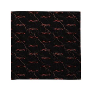 May include: Black textile with a repeating pattern of red lightning bolts and stylized red symbols. The design is symmetrical, with the lightning bolts and symbols evenly spaced across the fabric. The overall effect is a bold and striking design.