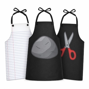 May include: Three aprons with black neck ties. The first is white with blue horizontal lines and a red vertical margin line. The second is black with a large gray rock graphic. The third is black with a graphic of gray scissors with red handles.