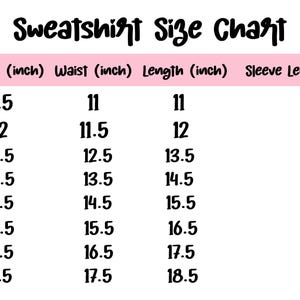 May include: A pink and white sweatshirt size chart with measurements in inches. The chart includes sizes from 6-12 months to YL, listing chest, waist, length, and sleeve length measurements for each size. The text "Sweatshirt Size Chart" is at the top.