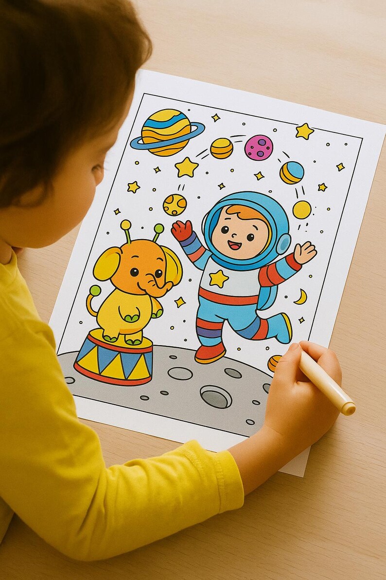 May include: A child coloring a space-themed illustration. The drawing features an astronaut, an elephant on a circus stand, planets, and stars. The astronaut is wearing a blue and red spacesuit. The elephant is yellow and orange.