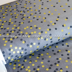 May include: Gray fabric with a repeating pattern of small gold and black circles.