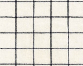 Può includere: Un tessuto bianco con un motivo a quadri bianco e nero.