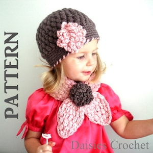 May include: A crocheted hat and scarf set in shades of brown and pink. The hat features a large pink flower accent. The scarf has a flower-shaped design with a dark brown center. The word "PATTERN" is visible on the left side of the image, and "Daisies Crochet" is at the bottom right.