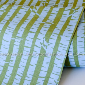 May include: Green and blue striped fabric with a white birch tree pattern. The fabric is folded and the text "A&A Cotton Creations" is visible.