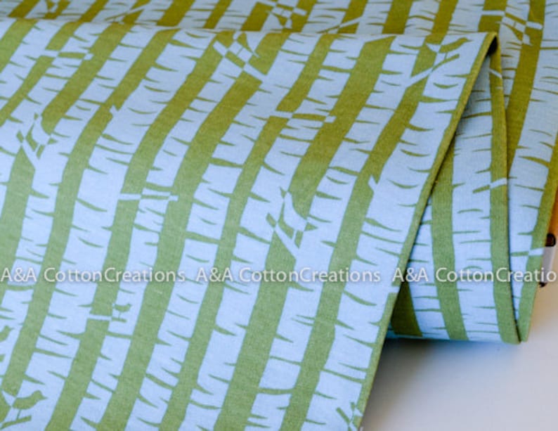 May include: Green and blue striped fabric with a white birch tree pattern. The fabric is folded and the text "A&A Cotton Creations" is visible.