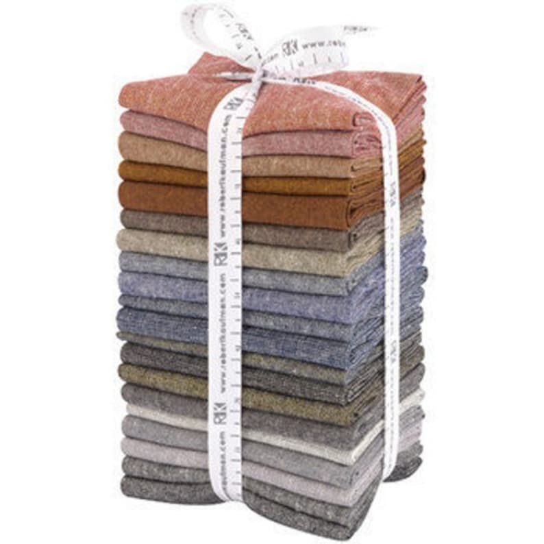 May include: A stack of 20 fabric squares in various shades of brown, gray, and blue, tied together with a white measuring tape. The fabric is a soft, textured linen blend.