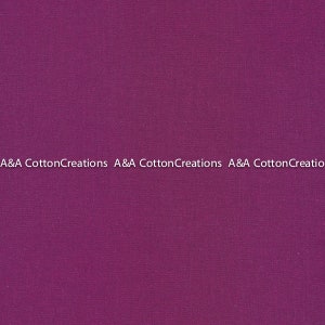 以下が含まれることがあります： 「A&A Cotton Creations」というテキストが3回繰り返された、無地の紫色の生地見本です。