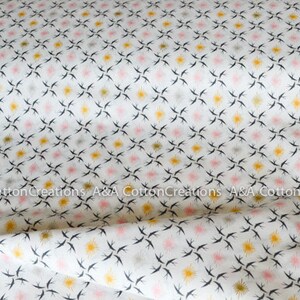 May include: White cotton fabric with a repeating pattern of black birds, pink and yellow stars.  A&A Cotton Creations is printed on the fabric.