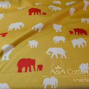 May include: Yellow fabric with a repeating pattern of white and red elephants. The elephants are in various sizes and positions. The fabric has the text "A&A Cotton creations" printed on it.