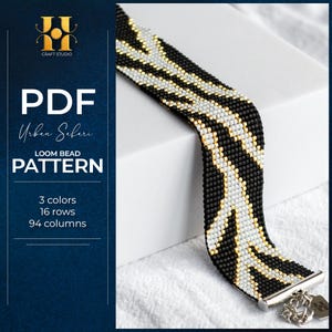 May include: A black, white, and gold beaded loom bracelet with a geometric design. The bracelet features small beads and a silver clasp. The image includes text: "PDF Urban Safari Loom Bead Pattern".