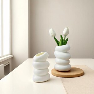 Stylish Nordic vase with a minimalist design. Perfect for buds or decor. Eye-catching accent for any room, table, or modern space.