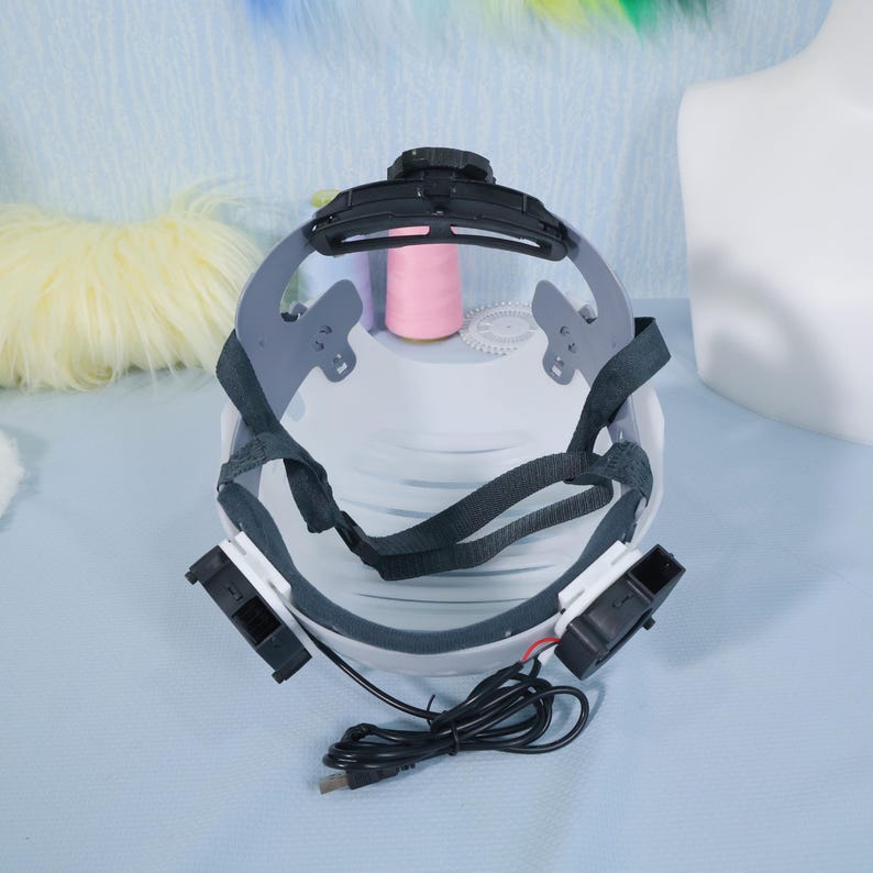 White cosplay helmet liner installed into a blue resin fursuit head, showing alignment with eyeholes and airflow vents. The liner’s structure helps maintain consistent shape and comfort, even during hours of wear. A useful tool for anyone building fursuit heads from scratch, this shell is customizable, breathable, and secure — designed with serious cosplay makers in mind.