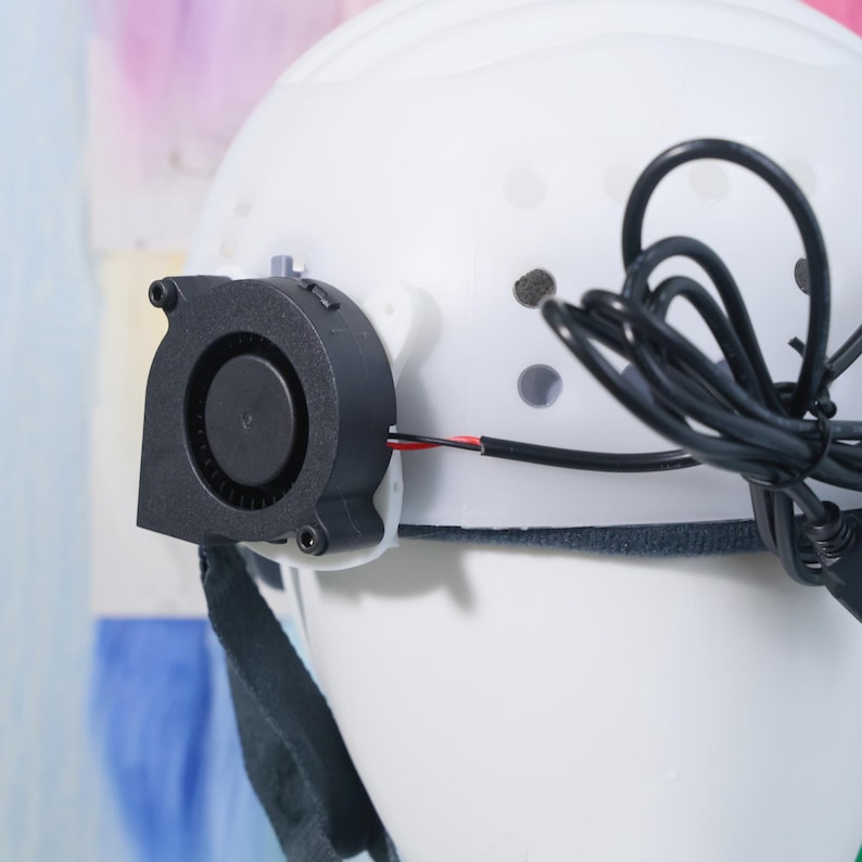 Breathable cosplay helmet insert made from sturdy white plastic with custom slots for attaching straps, fans, or padding. The adjustable system fits most head sizes and supports extended wear without slipping or overheating. Used by costume crafters and fursuit builders to create stable inner structures for complex head shapes, animal masks, or anime-style headgear.