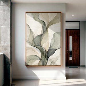 May include: A rectangular wall art piece featuring an abstract composition of flowing, translucent, sage green and cream-colored organic shapes that resemble layered fabric or petals, enclosed within a thin, light-toned wooden frame.