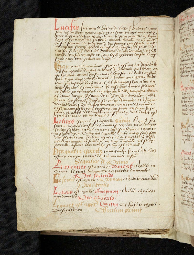 May include: Open book with handwritten text in Latin. The text is in black ink with red ink used for headings and initial letters. The pages are aged and show signs of wear, suggesting the book's age.