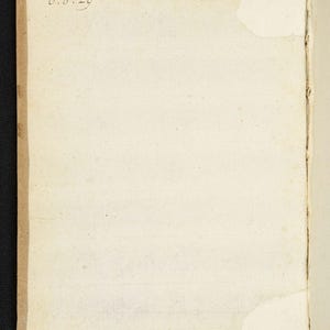 May include: Open book with aged, off-white pages. The edges of the pages are a light brown. The upper left corner has the handwritten date "0.8.29". The book is open to a blank page, with a torn corner.