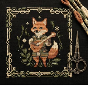 May include: A white ceramic mug with a black handle and the text "But First, Coffee" in a handwritten style. The mug is likely for hot beverages and has a glossy finish.