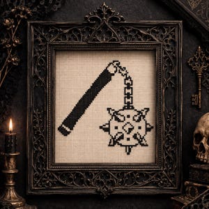May include: Black and white cross-stitch art of a medieval flail weapon, framed in an ornate dark frame. The flail is suspended by a chain. The background is a neutral color, and the overall aesthetic is gothic.