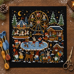 May include: A cross-stitch embroidery pattern on black fabric depicting a winter carnival scene with a ferris wheel, carousel, ice skating rink, and forest animals. The design features colourful figures, pine trees, and a crescent moon against a dark background.