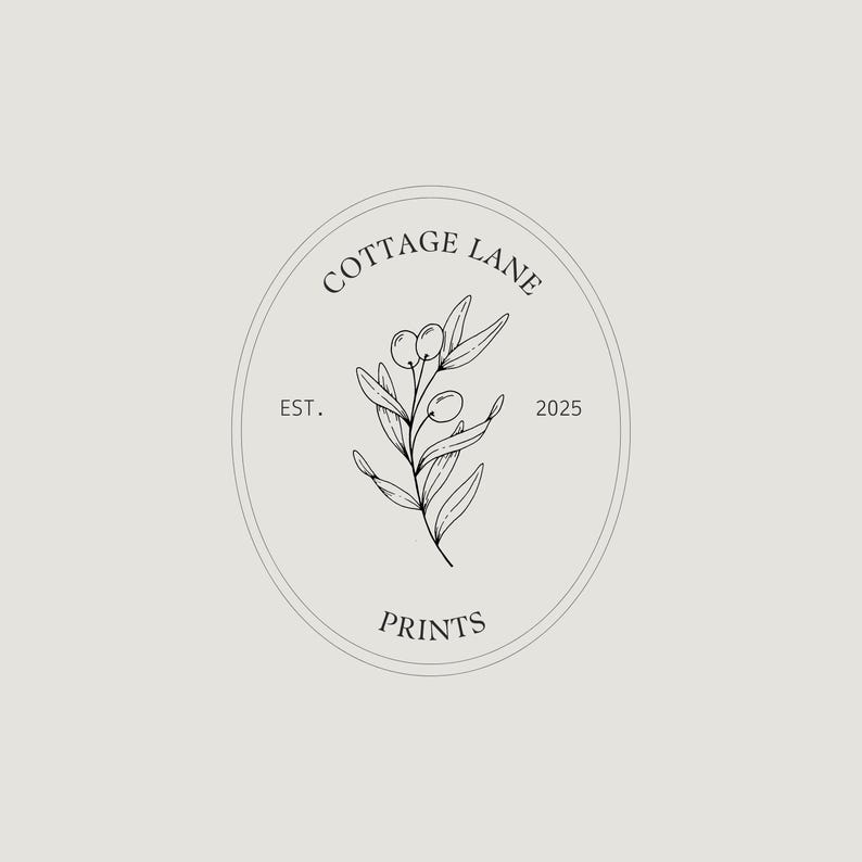 May include: A minimalist logo design for "Cottage Lane Prints" featuring an olive branch illustration within an oval frame. The text includes "Cottage Lane," "Prints," and the establishment year, "2025," all in a simple, elegant font.