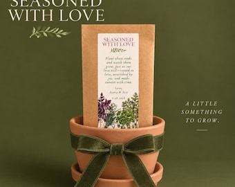 May include: A terracotta flower pot with a matching saucer, wrapped in a dark green velvet ribbon. Inside the pot sits a rectangular brown paper packet featuring the text "SEASONED WITH LOVE" and "Plant these seeds and watch them grow".
