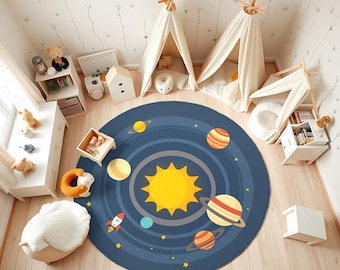 May include: A round, navy blue rug with a solar system design featuring a bright yellow sun, planets, and a rocket ship. The rug is in a child's playroom with white teepee tents and wooden furniture.