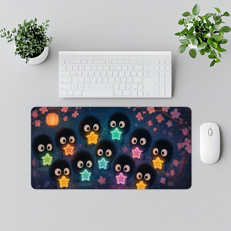 Soot Sprites Desk Mat Susuwatari Gaming Mat with colorful glowing stars in a magical galaxy design Perfect Japan decor and gift for Japanese anime lover Smooth surface and non slip base make this Spirited Away Ghibli mousepad ideal for gaming or office setups Miyazaki fan art inspired large desk accessory