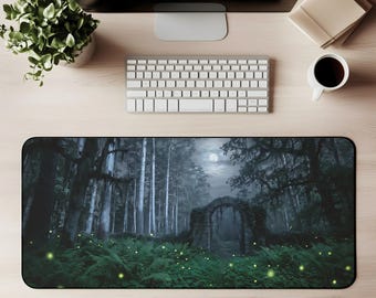 May include: A rectangular desk mat with a mystical forest scene under a full moon. The design includes a stone archway, tall trees, and glowing fireflies, creating a magical ambiance. The mat is designed to protect the desk surface.