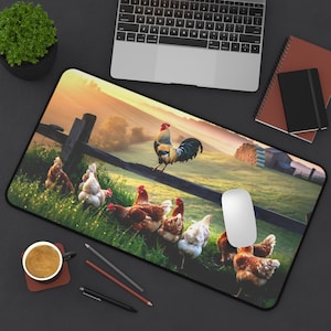 May include: A rectangular mouse mat with a rural farm scene. A rooster stands on a wooden fence, with chickens in a grassy field. The background shows a sunrise over a farm. A computer mouse is on the right.
