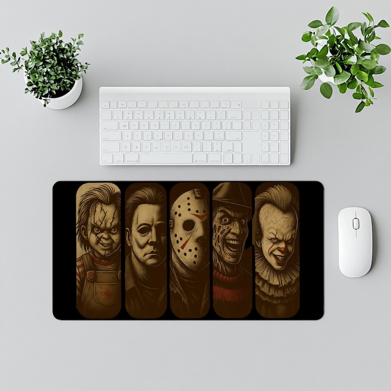 Horror Icons Desk Mat – Add spooky vibes to your desk with this chilling design featuring classic horror villains illustrated in dark detail. Perfect for Halloween lovers, horror fans, and gamers who enjoy creepy and bold desk decor. This oversized mat doubles as both a gaming mouse pad and an eye-catching workspace accessory