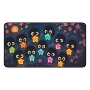 Susuwatari Gaming Mat with cute soot sprites holding colorful stars surrounded by lanterns and sakura petals on a galaxy background Large mousepad doubles as a whimsical Japan decor piece and makes the perfect gift for Japanese anime lover Inspired by Spirited Away Ghibli classics this Miyazaki fan art desk mat is both stylish and functional Smooth fabric top allows precise mouse tracking while non slip rubber base ensures stability