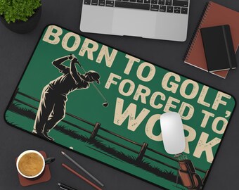 May include: A rectangular green mousepad with the text "BORN TO GOLF, FORCED TO WORK" in a vintage style. The design features a golfer swinging a club, a golf bag, and a wooden fence.