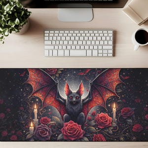 May include: A black rectangular mousepad featuring a gothic bat design with red wings, surrounded by red roses and candles. The bat has red ears and eyes. The background is dark with a starry night sky.