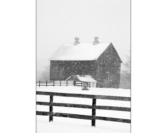 Rural Wood Barn and Farm Pasture Fence during Winter Snowstorm in Cascade Michigan A Black and White Fine Art Landscape Photograph