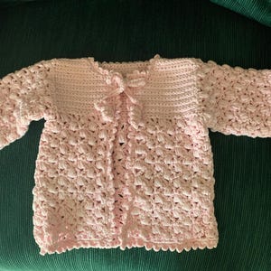 hand-crocheted pink baby sweater