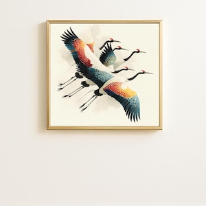May include: A framed print featuring a flock of cranes in flight. The birds have white bodies, black wingtips, and wings with red, orange, and blue accents. The artwork is set against a cream background and framed in gold.