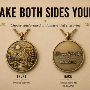 May include: A round bronze-toned pendant necklace featuring a mountain landscape with a sun, trees, and a river on the front. The back displays the engraved text 'Forever With Me' and the date '06.14.2025'. Text reads 'MAKE BOTH SIDES YOURS.'