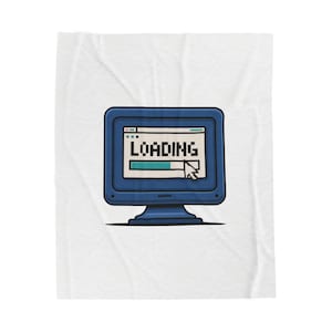 May include: A white blanket with a blue computer monitor graphic. The monitor displays the word "LOADING" in pixelated text, along with a loading bar and a cursor. The blanket has a crinkled texture.