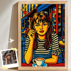 May include: Pop art style print of a woman in a cafe, holding a cigarette. The artwork features bold colors, including yellow, blue, and red. The woman wears a striped shirt and has long brown hair. A cup of coffee sits on the table.