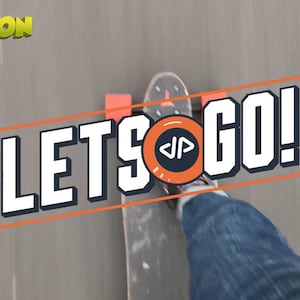 May include: Image of a skateboarder's perspective, with the board and a leg in jeans visible. The words "LET'S GO!" are prominently displayed in a bold, white font with an orange outline. The word "CARTOON" is in the top left corner.