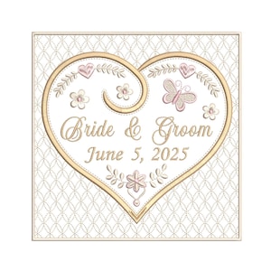May include: Embroidered design with a heart shape, the words "Bride & Groom", and the date "June 5, 2025". The design includes pink and gold floral and butterfly accents, set against a patterned background.