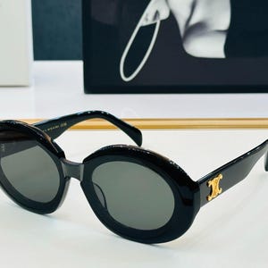 CELINE Women's Fashionable Designer  Oval Frame Sunglasses In Minimalist Design, Available In Six Colours, Perfect For Everyday Wear.