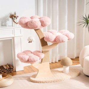 May include: A pink cat tree with three flower-shaped platforms and a mushroom-shaped base. The tree has a natural wood trunk wrapped in sisal rope. A plush cloud toy hangs from the top platform. The platforms are made of soft, fluffy material.