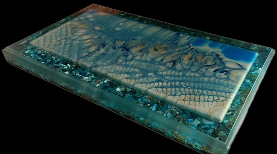 7x14inch acrylic pouring encased in 9.75x15.5inches of resin, turquoise mother of pearl and metal shavings
