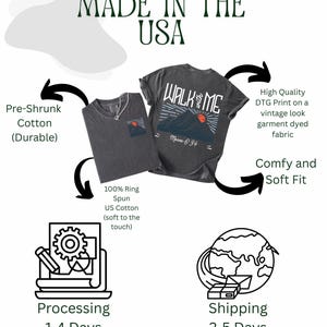 May include: Two charcoal gray t-shirts with the text "WALK with ME" and a mountain graphic. The shirts are made of pre-shrunk, 100% ring-spun US cotton. The image also includes text that says "Made in the USA".