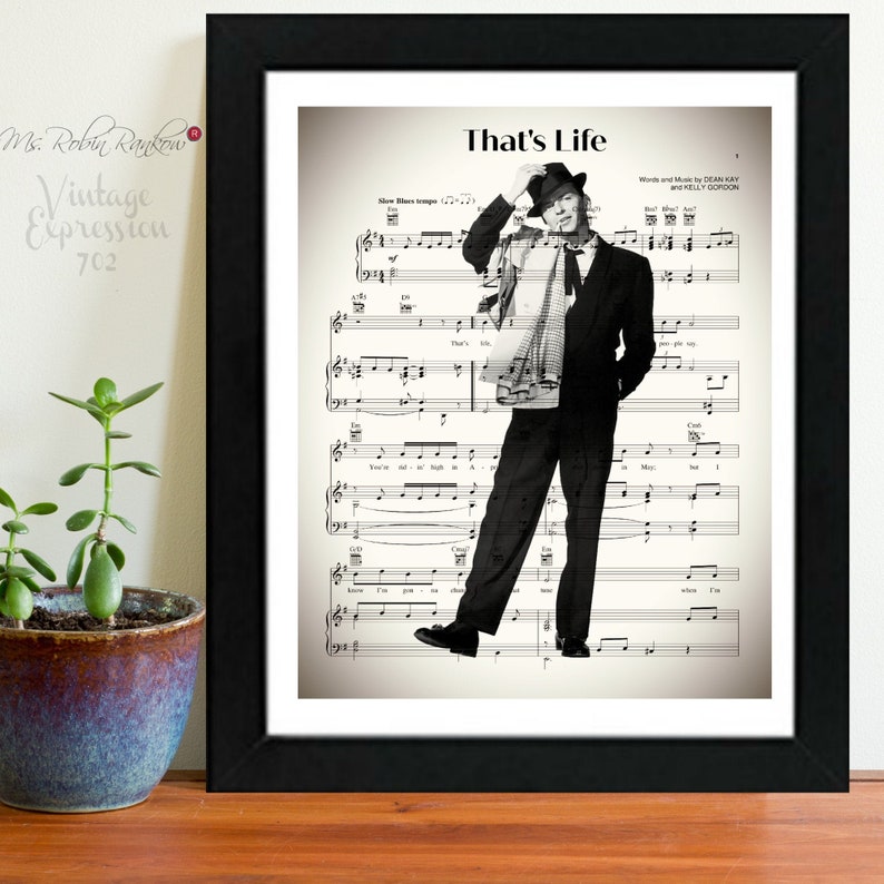 May include: Black and white photo of Frank Sinatra singing "That's Life" with sheet music in the background. The sheet music includes the lyrics and musical notes for the song.