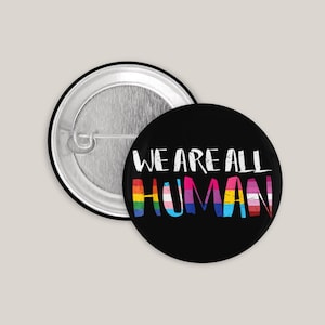 We Are All Human Button – LGBTQ+ Pride Badge for Jacket, Backpack & Bag